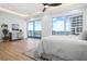 Bright, spacious bedroom with waterfront views, modern furniture, and hardwood floors at 870 N Osceola Ave, Clearwater, FL 33755