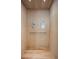 Interior view of a residential elevator with wooden paneling and simple controls at 870 N Osceola Ave, Clearwater, FL 33755