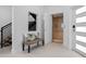 Elegant entryway with an elevator, a modern staircase, and a stylish bench at 870 N Osceola Ave, Clearwater, FL 33755