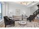 Stylish living room with elegant seating, a glass coffee table, and a serene ambiance at 870 N Osceola Ave, Clearwater, FL 33755