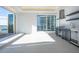Outdoor kitchen features a stainless vent hood, undercounter refrigerator, and stunning waterfront view at 870 N Osceola Ave, Clearwater, FL 33755