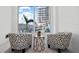 Cozy sitting area with stylish chairs overlooking a waterfront view with boats docked on the marina at 870 N Osceola Ave, Clearwater, FL 33755