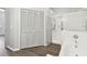Bright bathroom featuring a glass-enclosed shower, soaking tub, and closet with louvered doors at 915 Brittany Park Blvd, Tarpon Springs, FL 34689