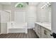 Bright bathroom featuring a soaking tub, walk-in shower, and double vanity at 915 Brittany Park Blvd, Tarpon Springs, FL 34689