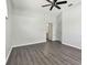 Neutral bedroom with hardwood floors and an ensuite bathroom at 915 Brittany Park Blvd, Tarpon Springs, FL 34689