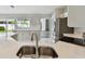 Bright kitchen featuring stainless steel appliances, ample counter space, and modern finishes at 915 Brittany Park Blvd, Tarpon Springs, FL 34689