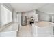 Bright kitchen featuring stainless steel appliances, ample counter space, and modern finishes at 915 Brittany Park Blvd, Tarpon Springs, FL 34689