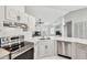 Well-equipped kitchen with stainless steel appliances and plenty of counter space at 915 Brittany Park Blvd, Tarpon Springs, FL 34689