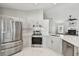 Well-equipped kitchen with stainless steel appliances and plenty of counter space at 915 Brittany Park Blvd, Tarpon Springs, FL 34689