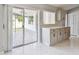 Kitchen area featuring sliding glass doors leading to the patio at 915 Brittany Park Blvd, Tarpon Springs, FL 34689