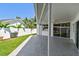 The patio featuring painted concrete, with a view of the fenced in yard at 915 Brittany Park Blvd, Tarpon Springs, FL 34689