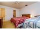 Comfortable bedroom with access to a bathroom and walk-in closet, furnished with two beds at 9170 Dupont Ave, Spring Hill, FL 34608