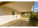 View of the home's carport featuring a concrete floor at 9170 Dupont Ave, Spring Hill, FL 34608