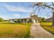 Charming single-story home with a carport and well-maintained front yard at 9170 Dupont Ave, Spring Hill, FL 34608