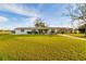 Charming single-story home with a well-manicured lawn and covered parking at 9170 Dupont Ave, Spring Hill, FL 34608