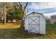Backyard shed with double doors for extra storage or hobby space at 9170 Dupont Ave, Spring Hill, FL 34608