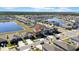 This aerial view showcases the home's location within a well-planned community featuring lakes and scenic surroundings at 9505 Lemon Drop Loop, Ruskin, FL 33573