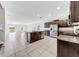 Open-concept kitchen with dark cabinets, granite counters, and a large island, perfect for entertaining and cooking at 9505 Lemon Drop Loop, Ruskin, FL 33573