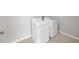 This laundry room comes complete with a full-sized washer and dryer at 9505 Lemon Drop Loop, Ruskin, FL 33573