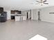 Spacious living area with tile floors, seamlessly connecting the kitchen, ideal for gatherings at 9505 Lemon Drop Loop, Ruskin, FL 33573