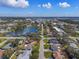 Aerial view of the property near a large pond at 9862 48Th N Ave, St Petersburg, FL 33708