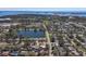 Expansive aerial view showcasing the property's location near a tranquil lake and city amenities at 9862 48Th N Ave, St Petersburg, FL 33708