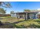 View of the backyard and screened-in porch at 9862 48Th N Ave, St Petersburg, FL 33708