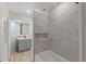 Newly remodeled bathroom with modern fixtures, tiled shower, and stylish vanity at 9862 48Th N Ave, St Petersburg, FL 33708