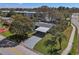 Charming home with well-maintained lawn, mature trees, and a convenient carport at 9862 48Th N Ave, St Petersburg, FL 33708