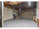 Spacious garage with gray painted floors, and a door at 9862 48Th N Ave, St Petersburg, FL 33708