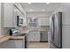 Modern kitchen with stainless steel appliances and butcher block countertops at 9862 48Th N Ave, St Petersburg, FL 33708
