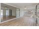 Bright sunroom featuring wood-look floors, lots of windows, a sliding door, and a ceiling fan at 9862 48Th N Ave, St Petersburg, FL 33708