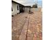 Spacious backyard patio with brick pavers, pergola, outdoor seating, and a fire pit feature at 11648 Palmetto Pine St, Riverview, FL 33569