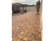 Large backyard featuring a brick-paved area, a pergola, and a privacy fence at 11648 Palmetto Pine St, Riverview, FL 33569