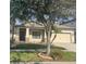 Lovely single-Gathering home with a well-maintained yard, stone accents, and attached two-car garage at 11648 Palmetto Pine St, Riverview, FL 33569