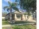 Charming single-story home with a well-manicured lawn, mature trees, and a two-car garage at 11648 Palmetto Pine St, Riverview, FL 33569