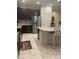 Well-appointed kitchen featuring an island with seating and modern appliances at 11648 Palmetto Pine St, Riverview, FL 33569