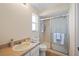 Modest bathroom with neutral walls, a standard countertop, and a shower with sliding glass doors at 1022 Mctavish Way, Palm Harbor, FL 34684