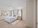 Cozy bedroom with neutral walls, updated light fixture, and a comfortable bed at 1022 Mctavish Way, Palm Harbor, FL 34684