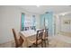 Traditional dining room features elegant table setting, decor, and natural light from a nearby window at 1022 Mctavish Way, Palm Harbor, FL 34684