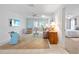 Bright living room featuring tile floors, comfortable seating, and a view into the sunroom at 1022 Mctavish Way, Palm Harbor, FL 34684
