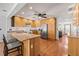 Kitchen featuring a center island, stainless steel appliances, wood cabinetry, and a ceiling fan at 11819 109Th Ct, Seminole, FL 33778