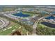 Extensive aerial view featuring community amenities like a swimming pool, tennis courts, and a golf course at 14191 Heritage Landing Boulevard # 1234, Punta Gorda, FL 33955