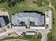 Birds eye view of new construction with a shingle roof, garages, and landscaping at 14191 Heritage Landing Boulevard # 1234, Punta Gorda, FL 33955