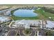 Overhead shot of the community clubhouse, golf course, and community lake at 14191 Heritage Landing Boulevard # 1234, Punta Gorda, FL 33955