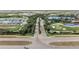 Panoramic aerial view showcasing the community layout with golf courses, roadways, and lush landscaping at 14191 Heritage Landing Boulevard # 1234, Punta Gorda, FL 33955