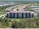 Aerial view of new construction with beautiful landscaping and lake views at 14191 Heritage Landing Boulevard # 1234, Punta Gorda, FL 33955
