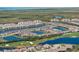 Aerial view of the community featuring golf course, lakes, and wetlands at 14191 Heritage Landing Boulevard # 1234, Punta Gorda, FL 33955