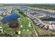 Wide aerial shot of the community, featuring golf course, lakes, and residential homes in a serene setting at 14191 Heritage Landing Boulevard # 1234, Punta Gorda, FL 33955