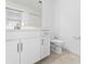This bathroom features a vanity with a long countertop, modern fixtures and a toilet at 14191 Heritage Landing Boulevard # 1234, Punta Gorda, FL 33955